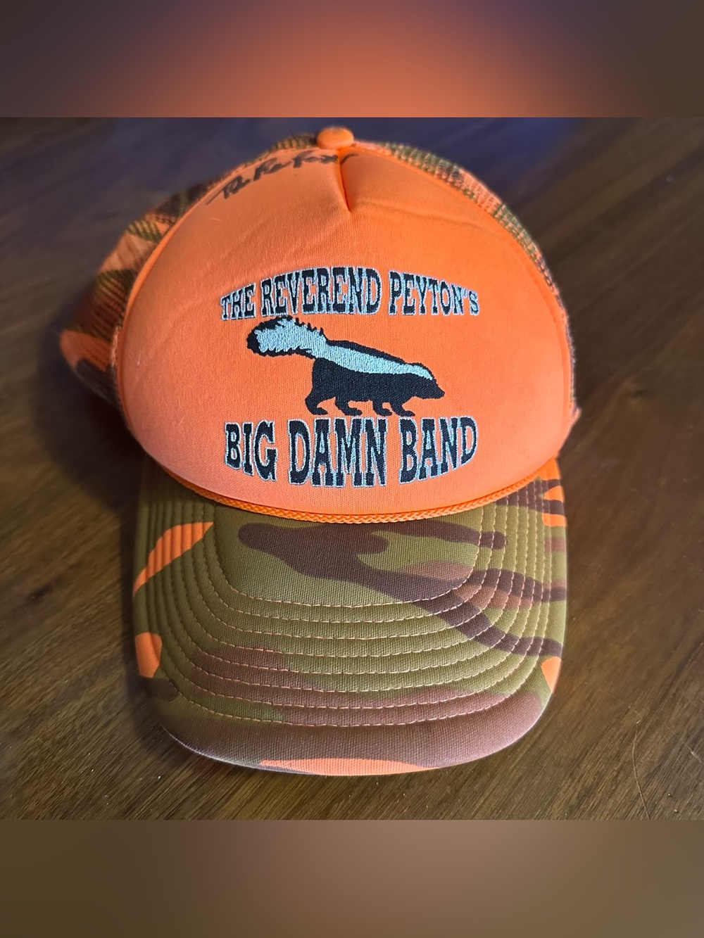 The Reverend Peyton's Big Damn Band Orange Camo Trucker Hat Signed